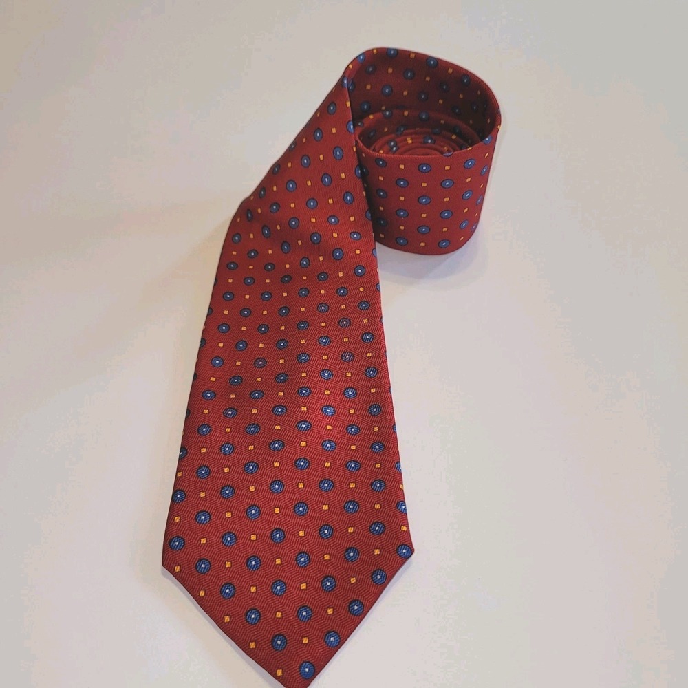 Lauren Ralph Lauren red silk necktie featuring a geometric blue and yellow...